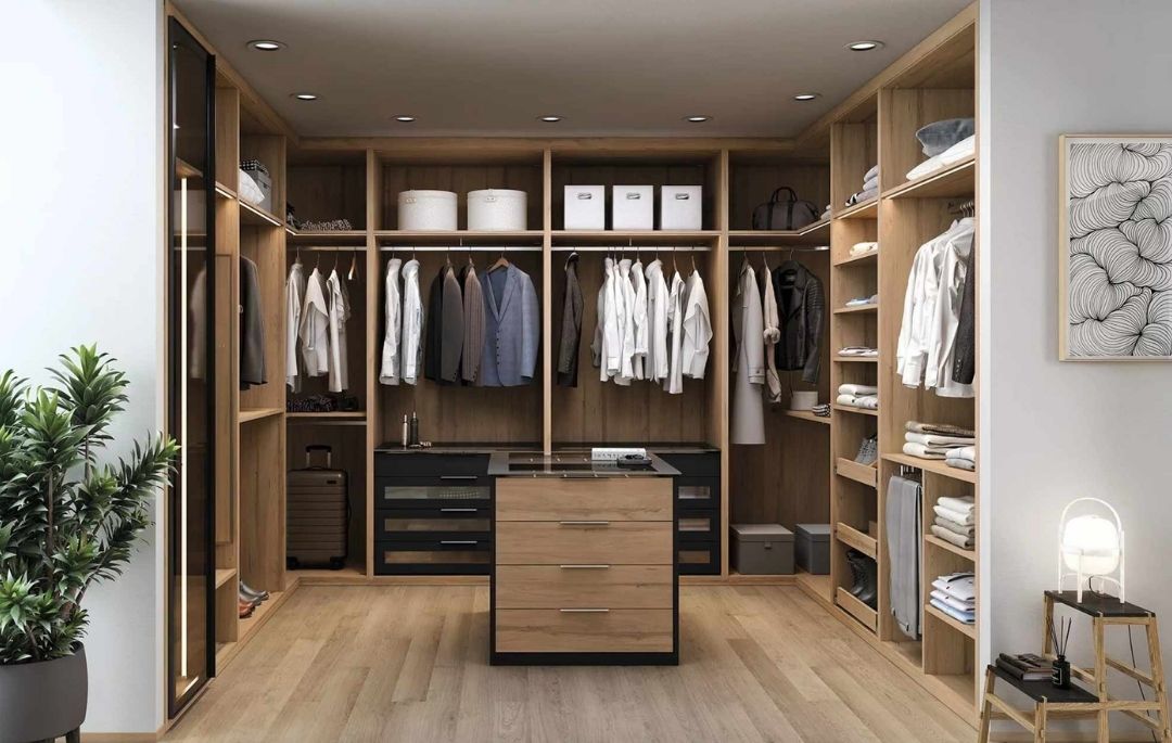 Armario vestidor a medida de madera con cajoneras, estanterías y zona de colgar