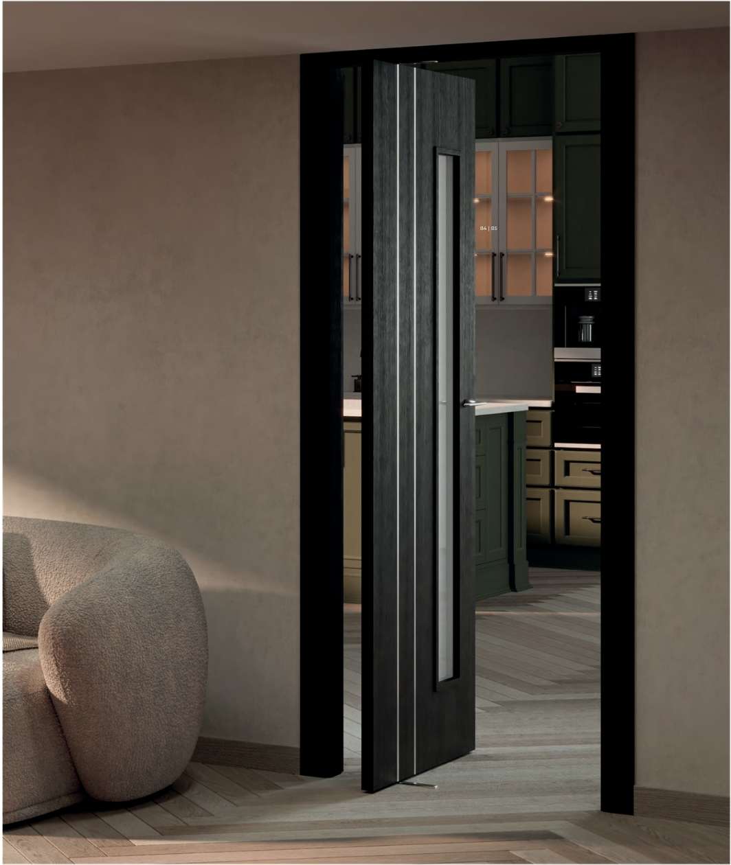 Puertas a medida Málaga Puerta pivotante oscura con cristal vertical